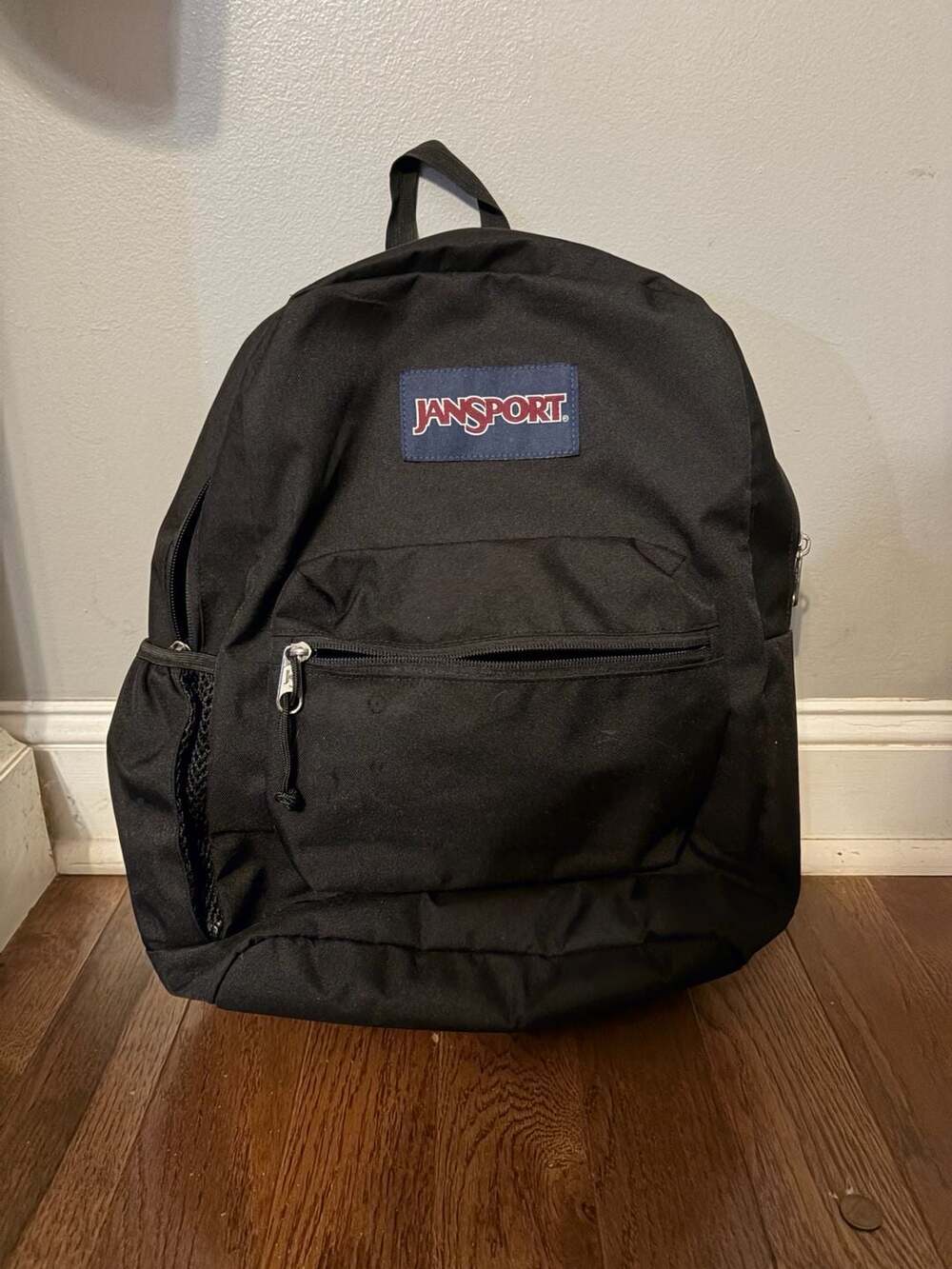 JanSport Black Backpack with Front Zipper Pocket